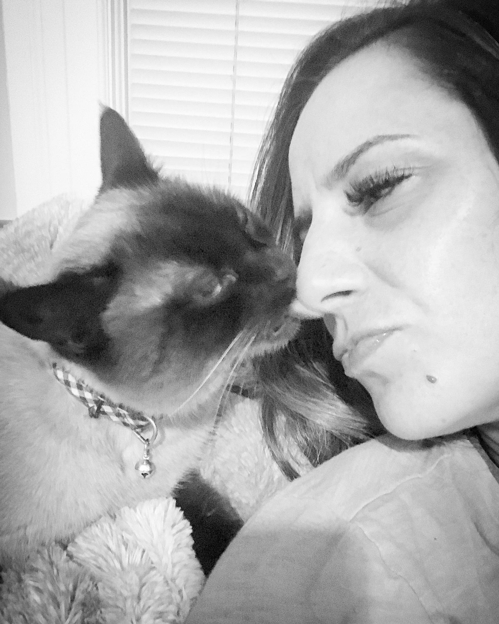 George is registered to the contest to win money with this photo: beauty, black_and_white, carnivore, cat, cheek, ear, eye, eyebrow, felidae, forehead, fur, human, interaction, lip, love, mouth, nose, small_to_medium_sized_cats, snout, whiskers