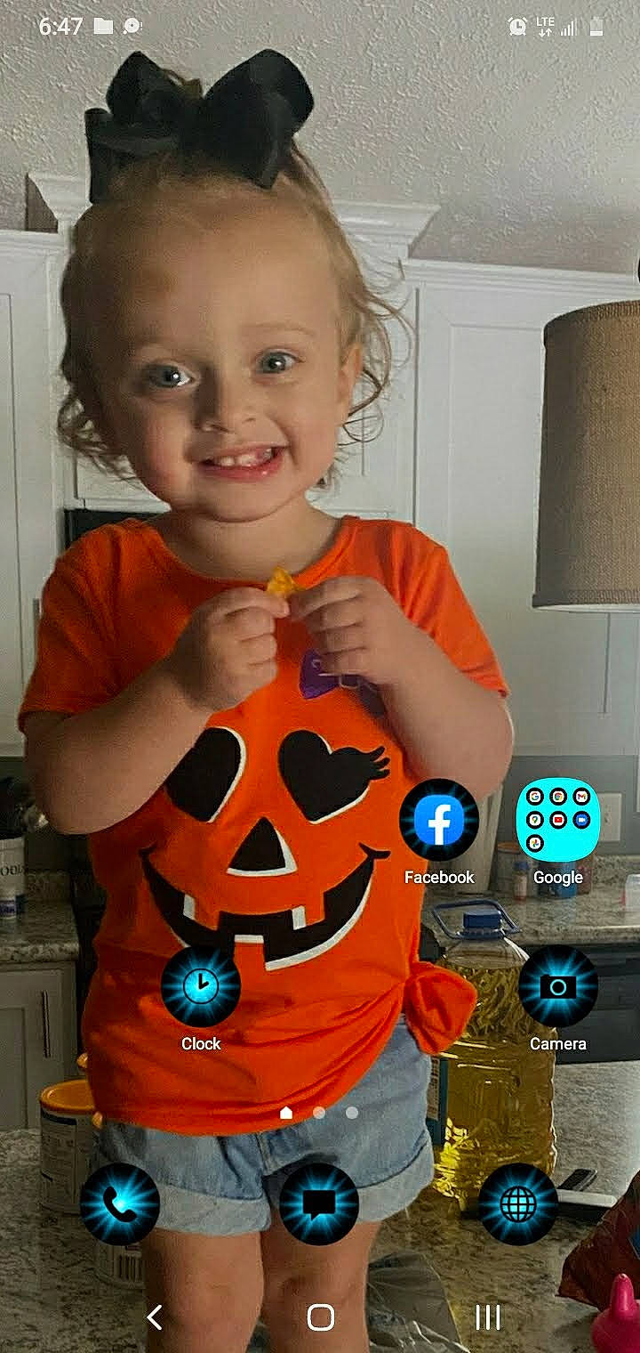 Wynter is registered to the contest to win money with this photo: chest, child, electric_blue, fictional_character, finger, fun, gesture, happy, home_appliance, joy, muscle, orange, pattern, person, personal_protective_equipment, play, product, shorts, sleeve, smile