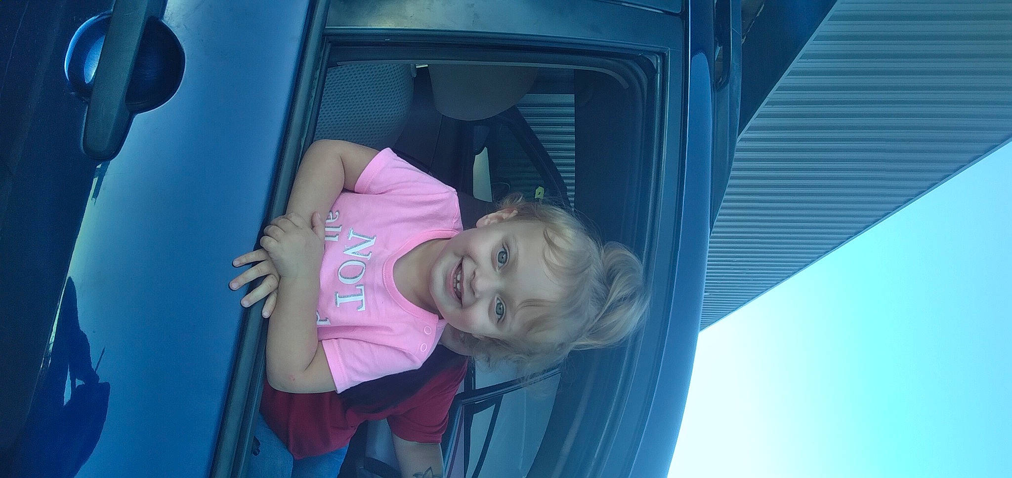 Wynter is registered to the contest to win money with this photo: auto_part, automotive_exterior, automotive_lighting, automotive_window_part, baby, baby_products, baby_toddler_clothing, bumper, car_seat, child, electric_blue, family_car, fun, joy, motor_vehicle, person, toddler, tree, vehicle, vehicle_door