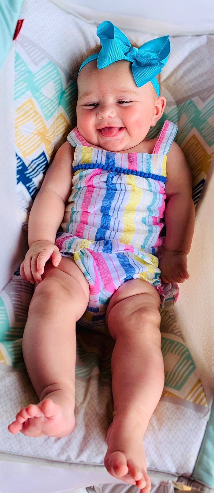 Kenleigh is registered to the contest to win money with this photo: baby, baby_products, baby_toddler_clothing, cheek, child, child_model, diaper, face, finger, joy, leg, mouth, pattern, person, sitting, skin, smile, thigh, toddler