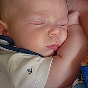 Frank is registered to the contest to win money with this photo: baby, sleeping, infant, closeup, face, arm, clothing, blanket, pattern, cute, peaceful, child, person, skin, nap, rest, indoors, soft, comfort, toddler