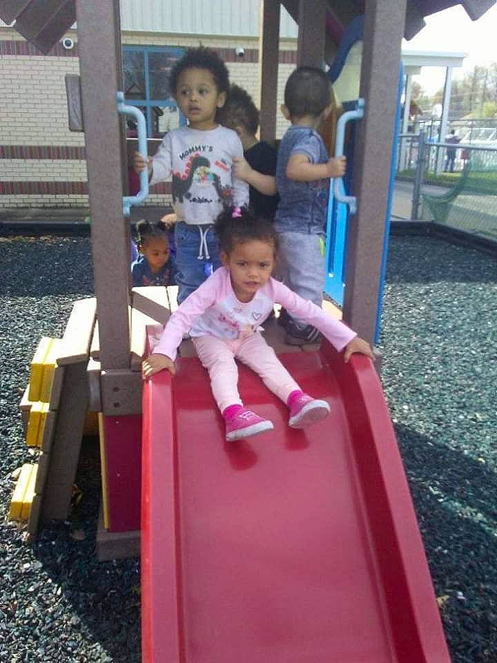 Nelia is registered to the contest to win money with this photo: child, chute, city, fun, human_settlement, leisure, outdoor_play_equipment, person, pink, play, playground, playground_slide, public_space, recreation, toddler