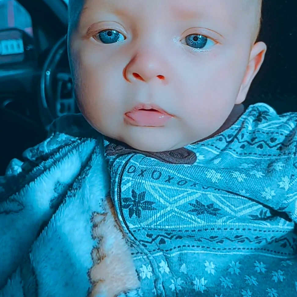 Aerian Walker joined the competition — help win amazing prizes! baby, blanket, blue_eyes, car_interior, closeup, cozy, cute, face, indoors, infant, light, patterned_clothing, portrait, seat, soft_light, toddler, warm, wearing, young_child, zipped_jacket