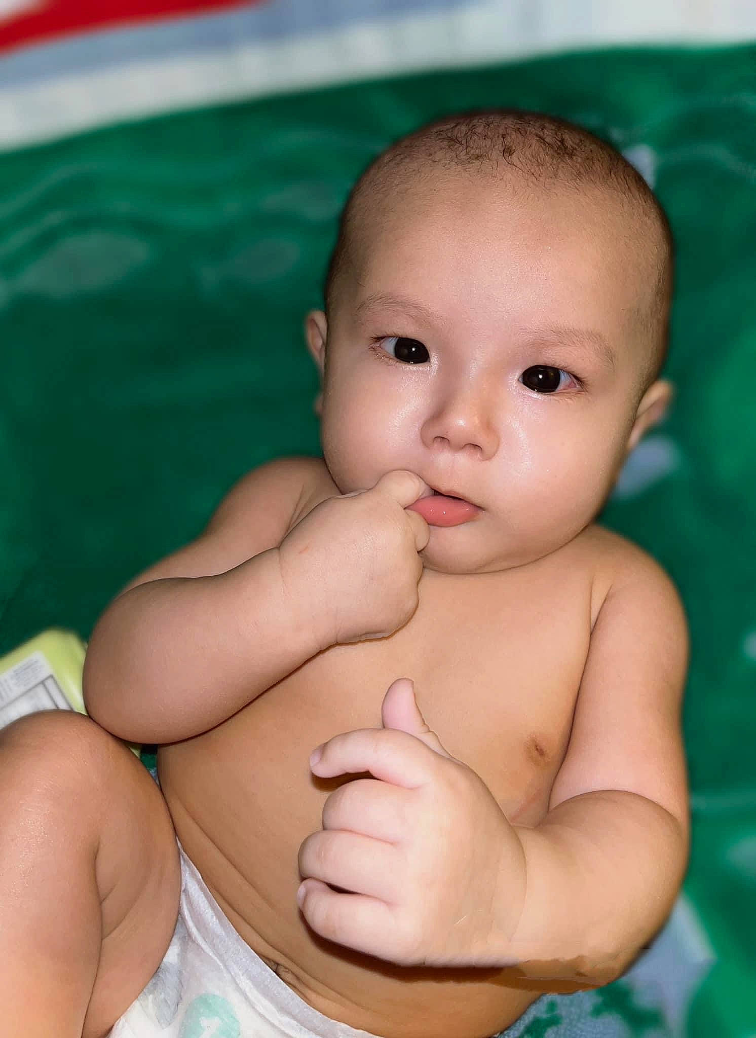 Cyrus is registered to the contest to win money with this photo: baby, cheek, chest, chin, eye, eyebrow, finger, gesture, hair, happy, human_body, iris, muscle, neck, nose, person, skin, stomach, thumb, toddler