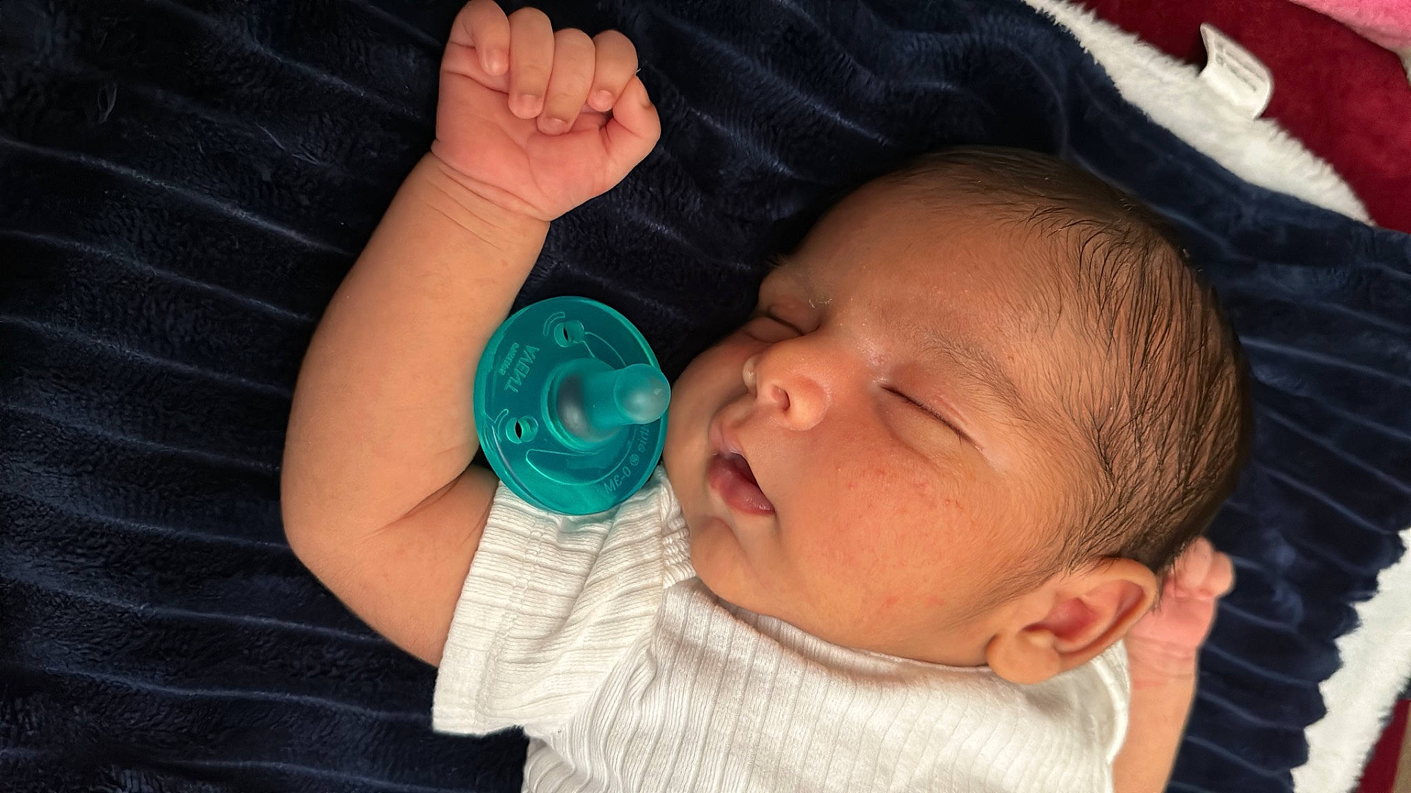 Sebastian is registered to the contest to win money with this photo: baby, baby_toddler_clothing, cheek, child, comfort, drinkware, ear, finger, gesture, hand, iris, lip, mouth, nail, nose, organ, person, skin, thumb, toddler