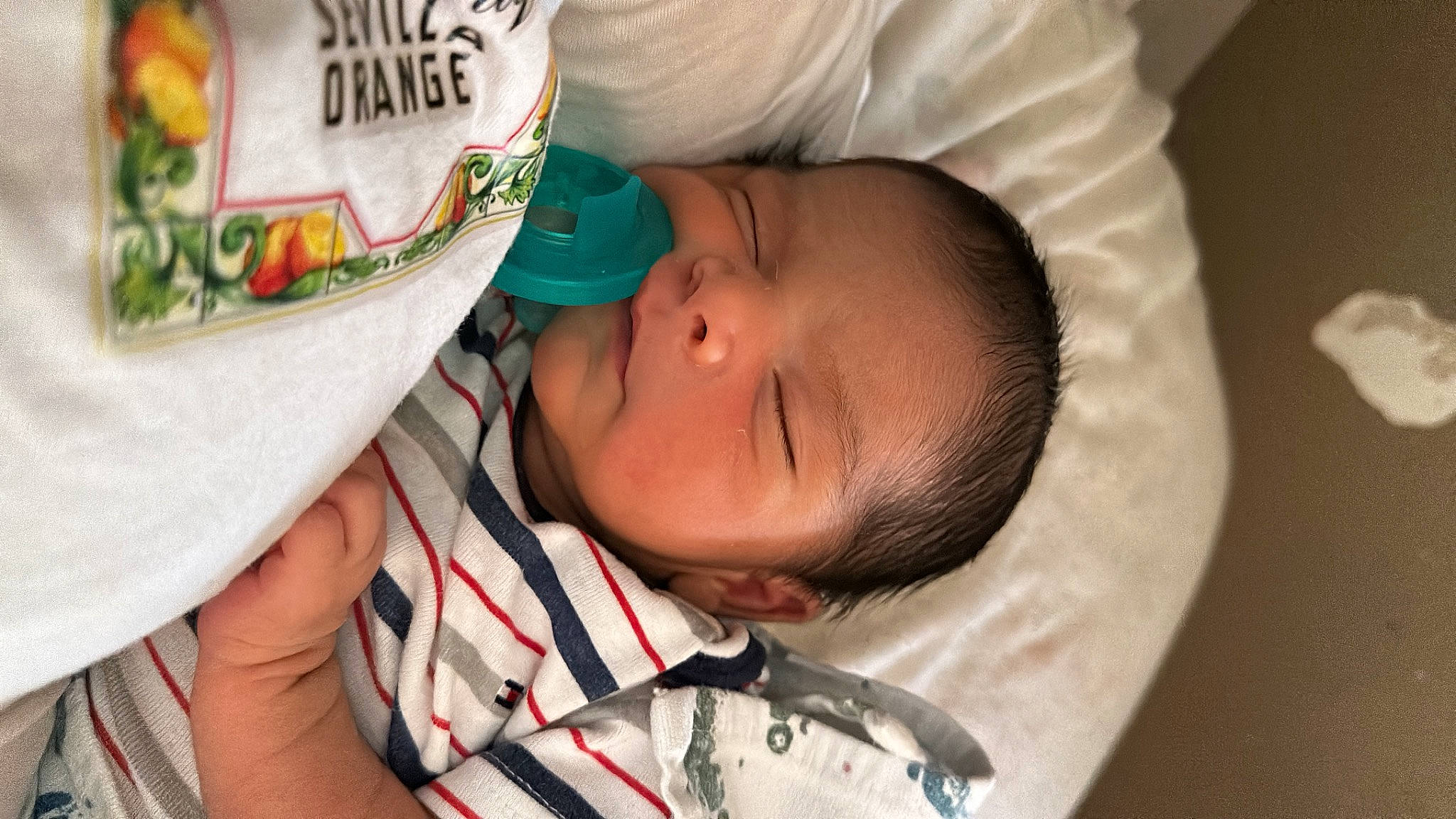 Sebastian is registered to the contest to win money with this photo: baby, baby_products, baby_toddler_clothing, cheek, child, comfort, ear, eye, face, facial_expression, finger, happy, hat, mouth, nail, nose, pattern, person, skin, sleep