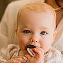 Andrea participe au concours pour gagner de l'argent avec cette photo : baby, child, pacifier, blue_eyes, face, hand, soft_lighting, portrait, infant, cute, closeup, person, skin, expression, clothing, young_child, indoor, warm_tone, blurred_background, holding