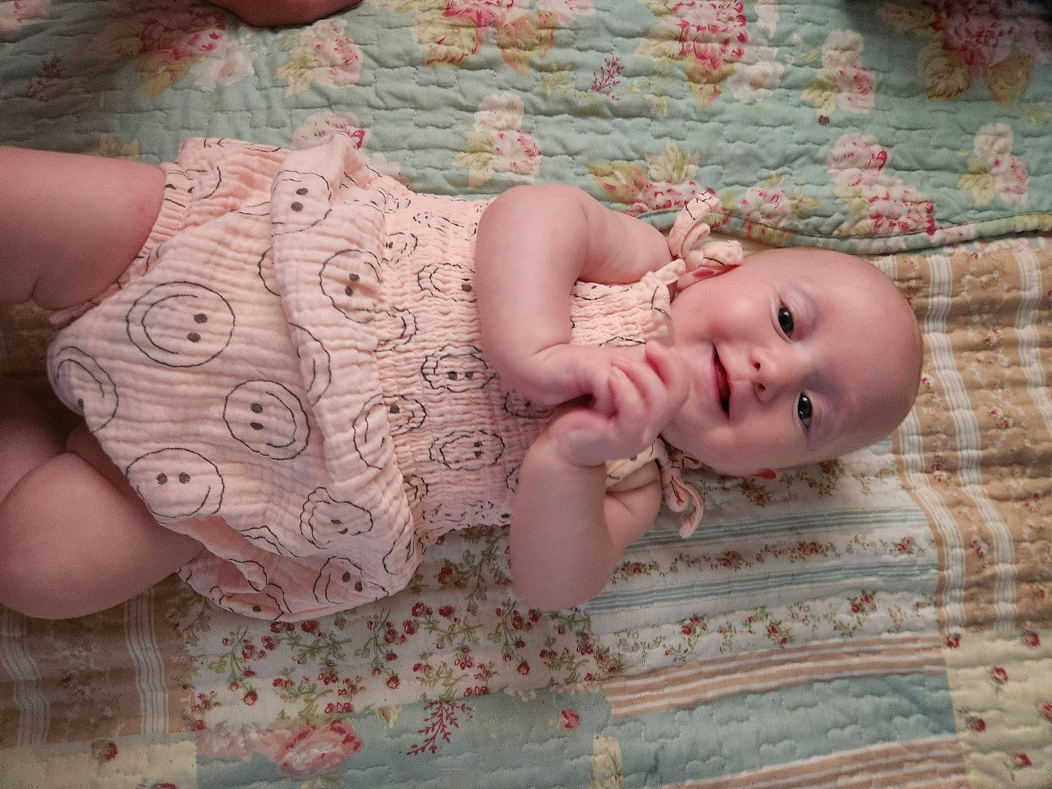 Avaleigh is registered to the contest to win money with this photo: arm, baby, baby_toddler_clothing, dress, eye, eyelash, fawn, grass, hand, human_body, joy, lip, neck, pattern, person, pink, plant, skin, toddler, trunk