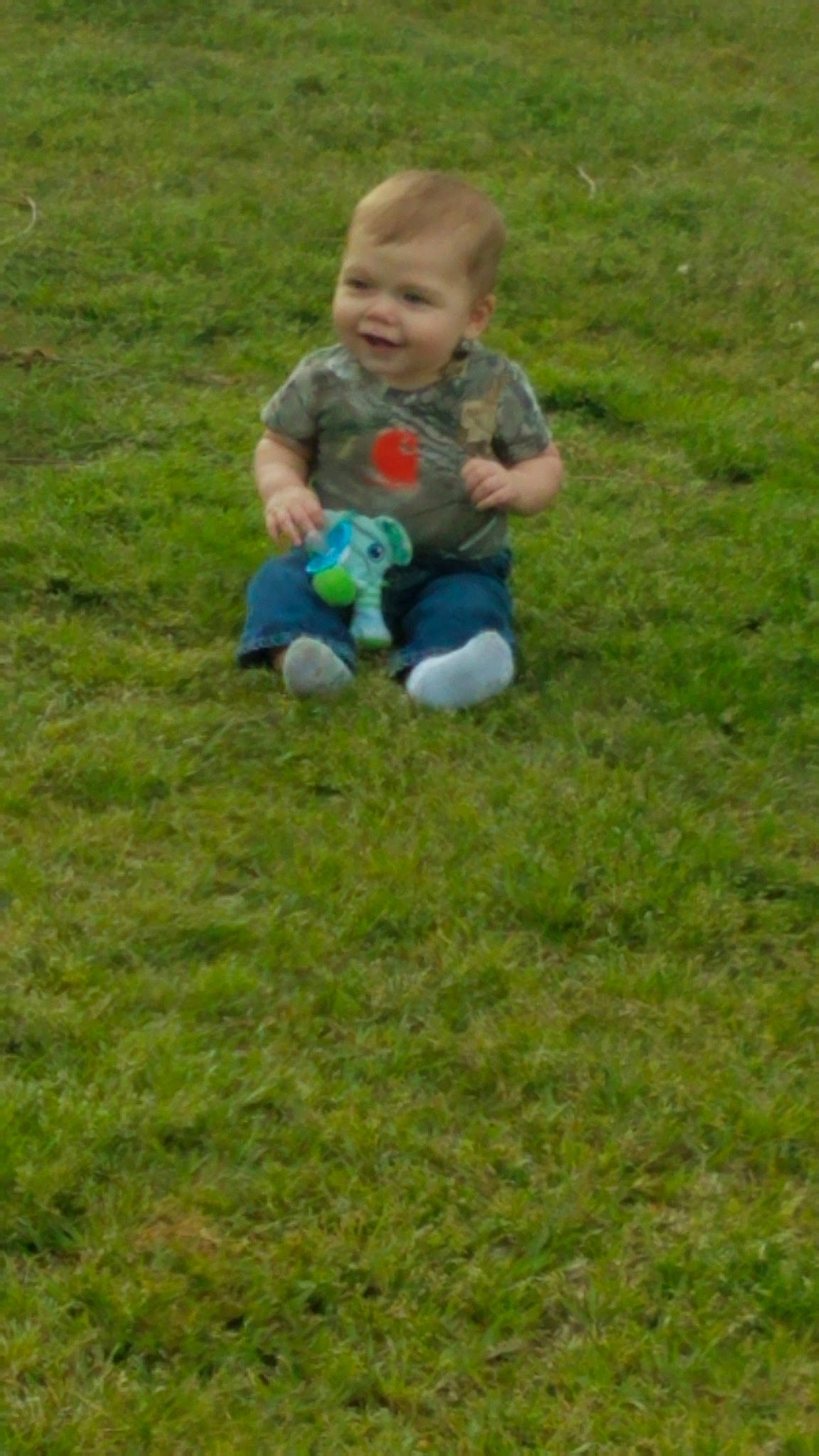 Joseph is registered to the contest to win money with this photo: child, grass, grass_family, grassland, green, lawn, meadow, person, plant, play, sitting, toddler, yard