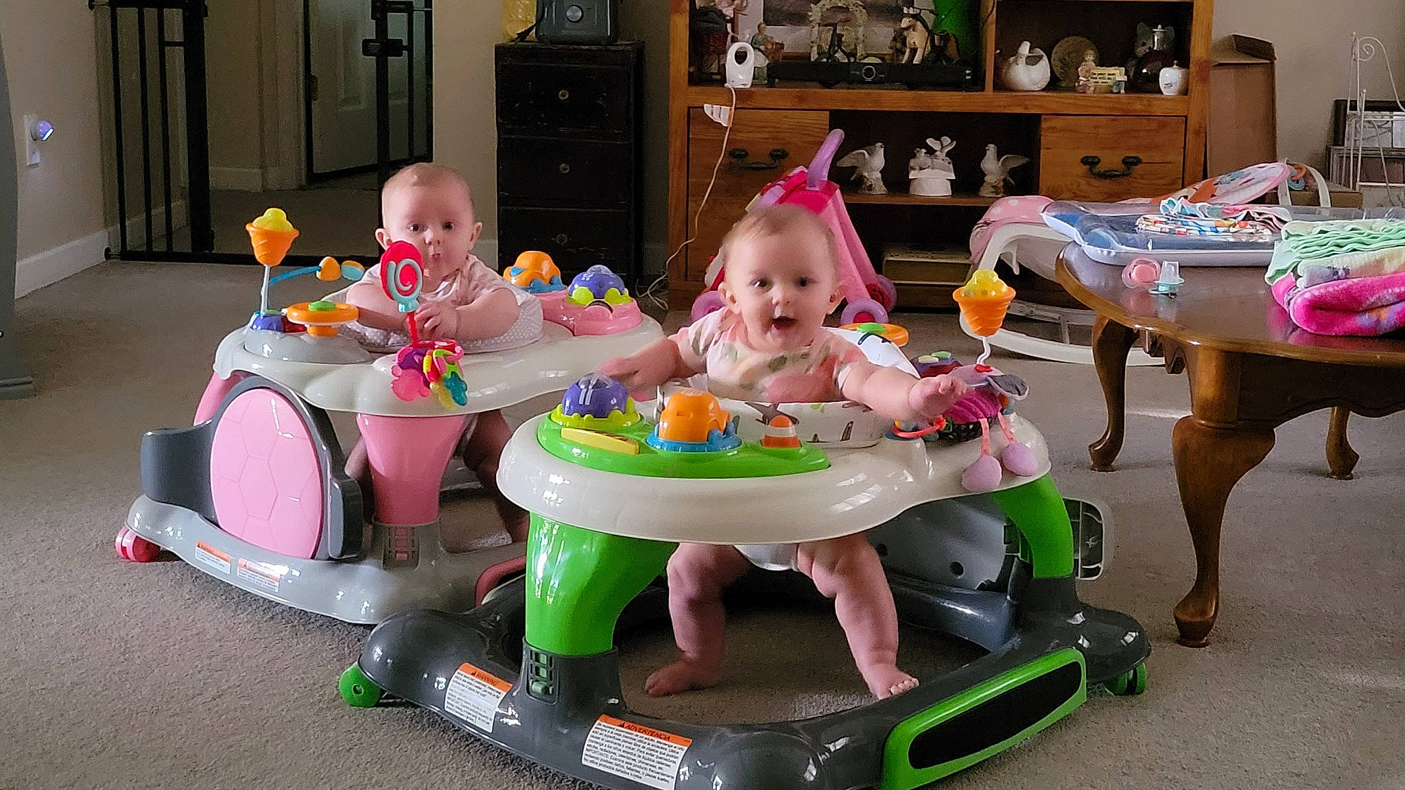 Madisyn is registered to the contest to win money with this photo: amusement_ride, baby_products, baby_toys, bumper, child, event, fun, leisure, party, person, picture_frame, pink, play, product, recreation, riding_toy, room, sitting, smile, toddler