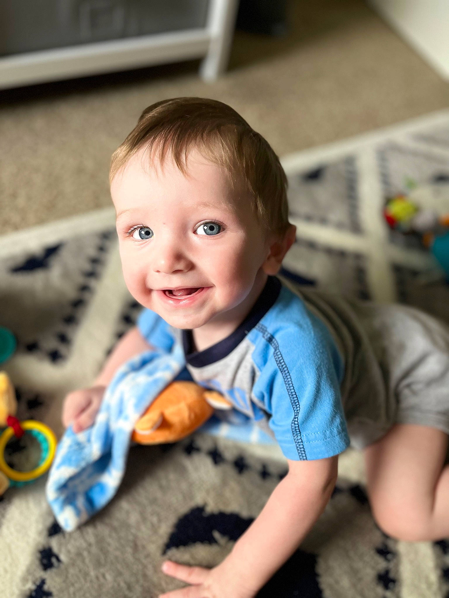 Brody joined the competition — help win amazing prizes! baby, baby_toddler_clothing, cheek, child, electric_blue, eye, face, flooring, fun, hairstyle, happy, head, iris, person, sitting, skin, sleeve, smile, t_shirt, toddler
