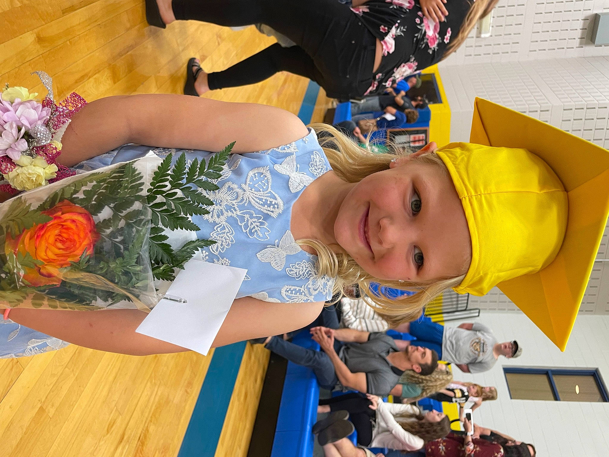 Emma is registered to the contest to win money with this photo: baby, bouquet, chair, child, clothing, event, flower, flower_arranging, fun, happy, hat, headwear, joy, leisure, orange, person, plant, rose, smile, summer