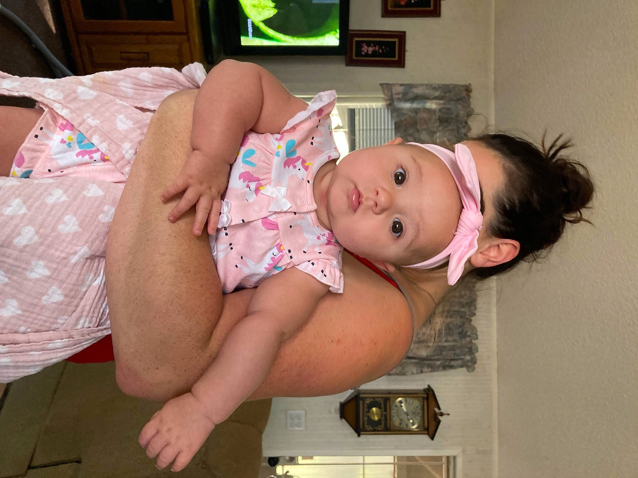 Leila is registered to the contest to win money with this photo: abdomen, baby, chest, child, comfort, elbow, flesh, foot, fun, happy, hat, headwear, human_leg, knee, pattern, person, picture_frame, room, stomach, thigh