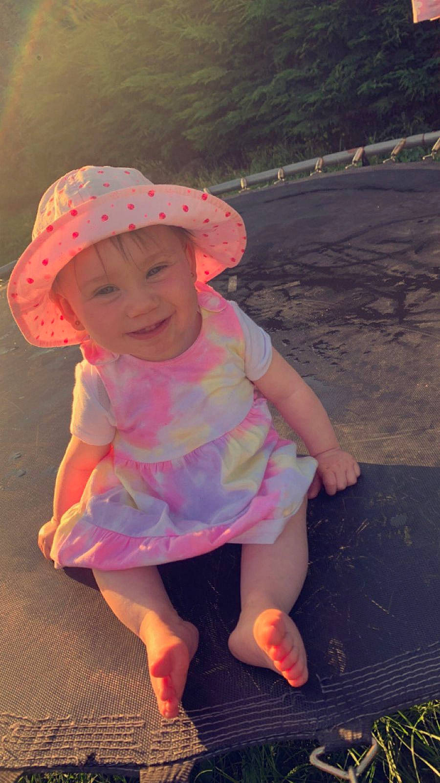 Inaya a rejoint le concours — aidez-le/la à gagner de superbes lots ! baby_toddler_clothing, cap, child, dress, fashion_accessory, fun, grass, happy, hat, headwear, joy, magenta, morning, pattern, people_in_nature, person, pink, recreation, smile, summer