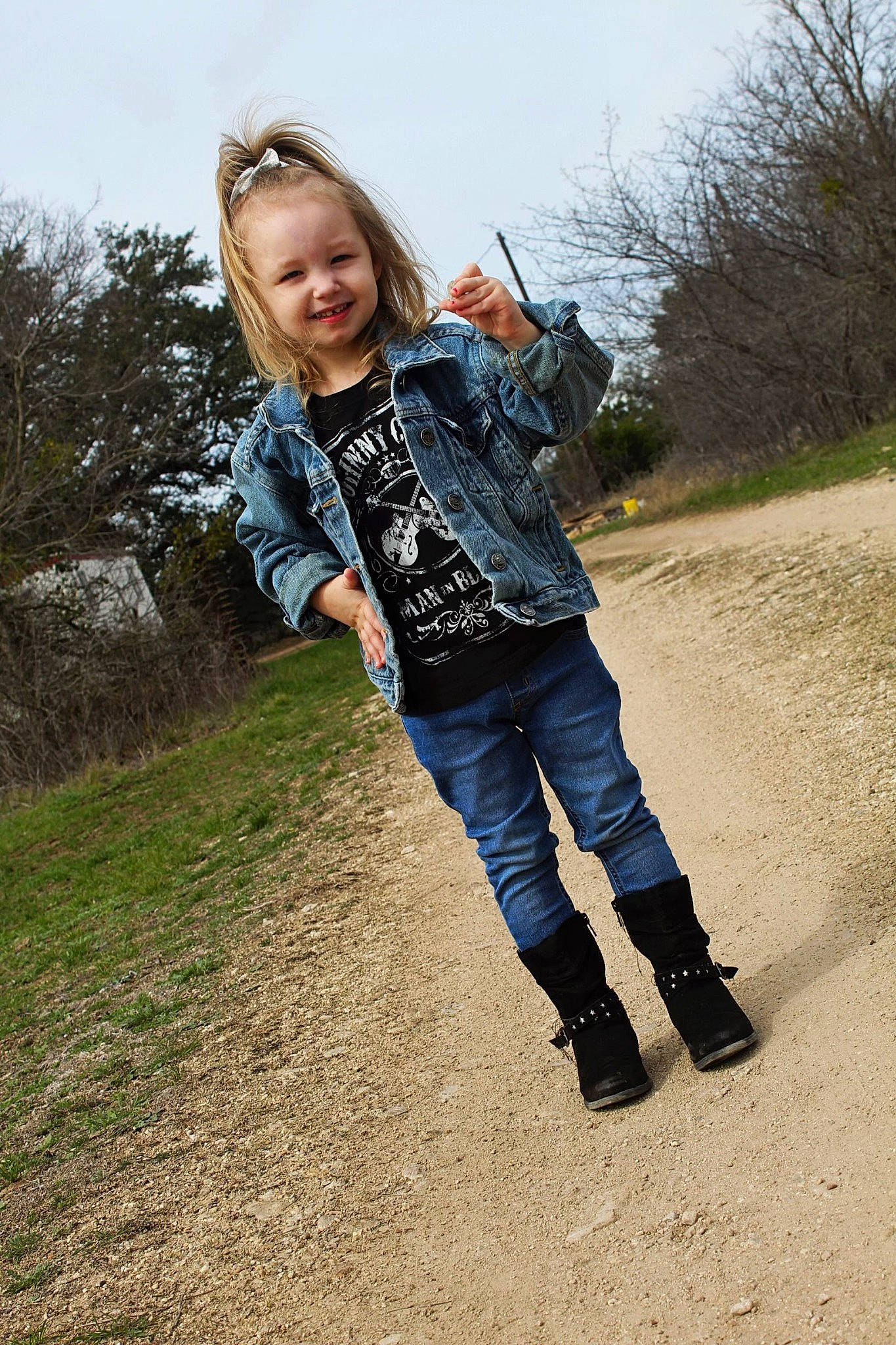 Melody is registered to the contest to win money with this photo: boot, denim, electric_blue, flash_photography, grass, grassland, happy, human_leg, jacket, jeans, joy, knee, landscape, people_in_nature, person, plant, sky, sleeve, t_shirt, toddler