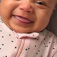 Stella joined the competition — help win amazing prizes! baby, smiling, close_up, face, infant, pink_outfit, heart_pattern, happy, child, cute, portrait, young, skin, eyes, mouth, tongue, clothing, baby_girl, indoors, person