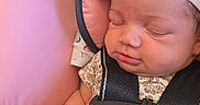 Ke'Nylah is registered to the contest to win money with this photo: adorable, baby, blanket, bow, car_seat, child, close_up, cute, floral_pattern, headband, indoors, infant, peaceful, pink, resting, safety_belt, skin, sleeping, soft, strapped