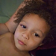 Ke'Aire joined the competition — help win amazing prizes! child, adult, curly_hair, face, portrait, closeup, resting, indoor, skin, person, arm, expression, comfort, intimate, casual, family, love, relaxation, human, together