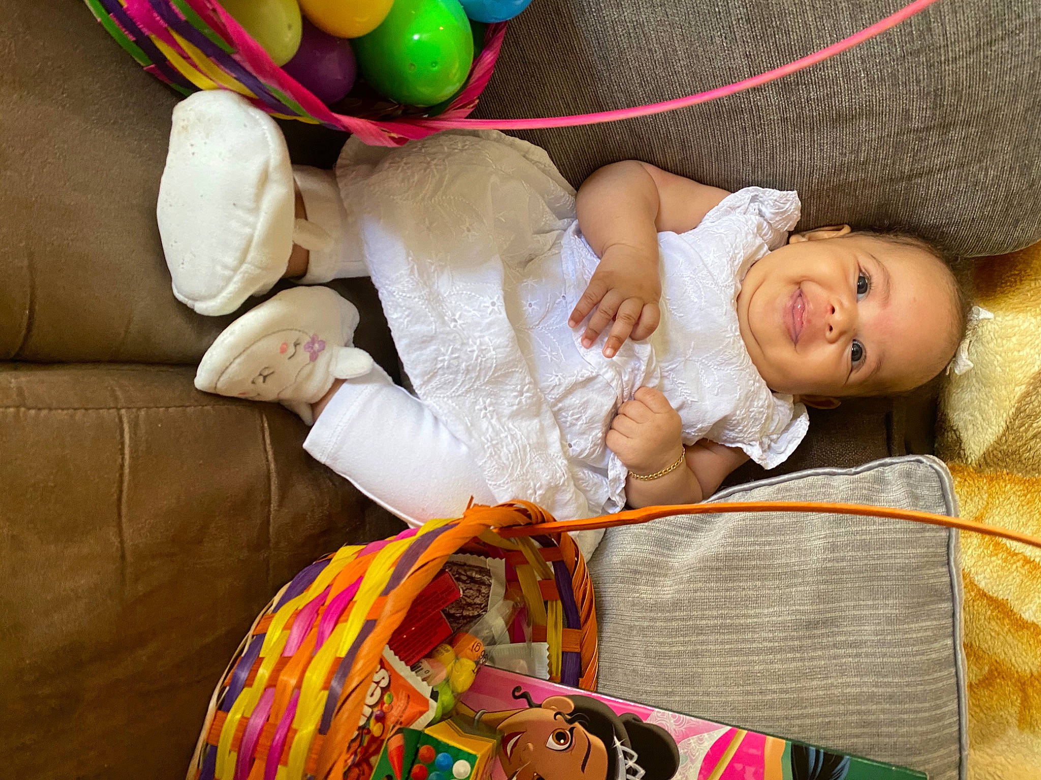 Janiyah is registered to the contest to win money with this photo: baby, baby_products, bag, basket, child, comfort, event, facial_expression, fashion_accessory, fun, happy, headgear, joy, linens, pattern, person, play, product, room, sitting