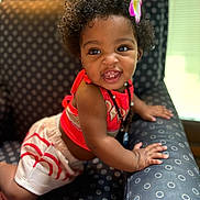 Everleigh joined the competition — help win amazing prizes! toddler, child, smiling, curly_hair, flower, red_top, shorts, armchair, polka_dot, happy, indoor, skin, person, cute, baby, playful, furniture, portrait, natural_light, hand
