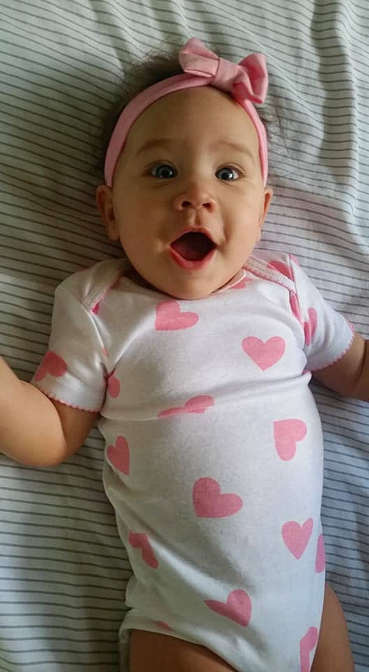 Cheyanne joined the competition — help win amazing prizes! baby, baby_products, baby_toddler_clothing, cheek, child, face, facial_expression, head, lip, mouth, neck, nose, person, pink, product, skin, sleeve, smile, toddler