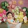 child, baby, toddler, bathtub, milk_bath, balloons, pink_background, green_balloons, floral, daisies, bow, party_decor, one_sign, portrait, studio_photography, props, flowers, sitting, curious_expression, decorations