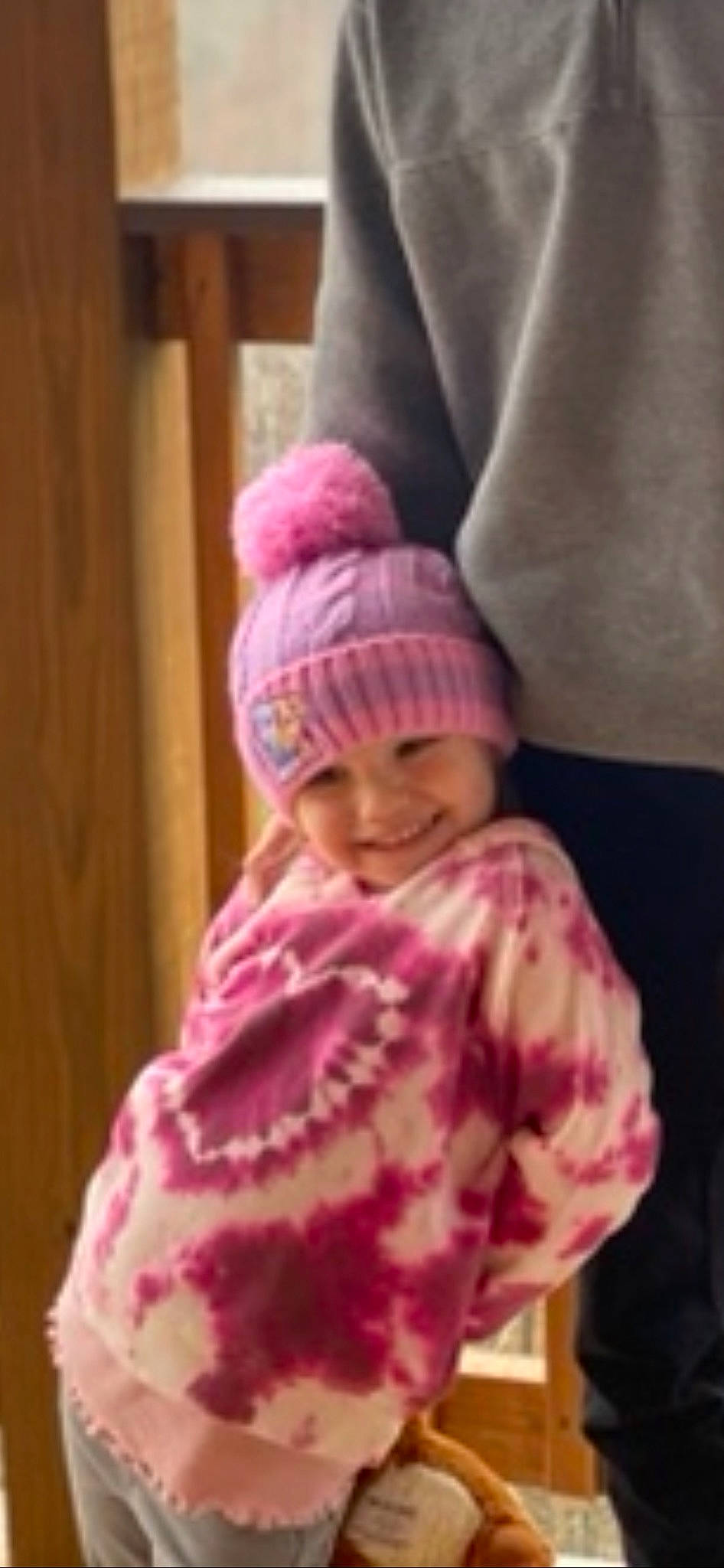 Kennedy is registered to the contest to win money with this photo: arm, baby, baby_toddler_clothing, cap, comfort, hand, headgear, headwear, joy, knit_cap, linens, magenta, outerwear, pattern, person, pink, purple, sleeve, thumb, toddler