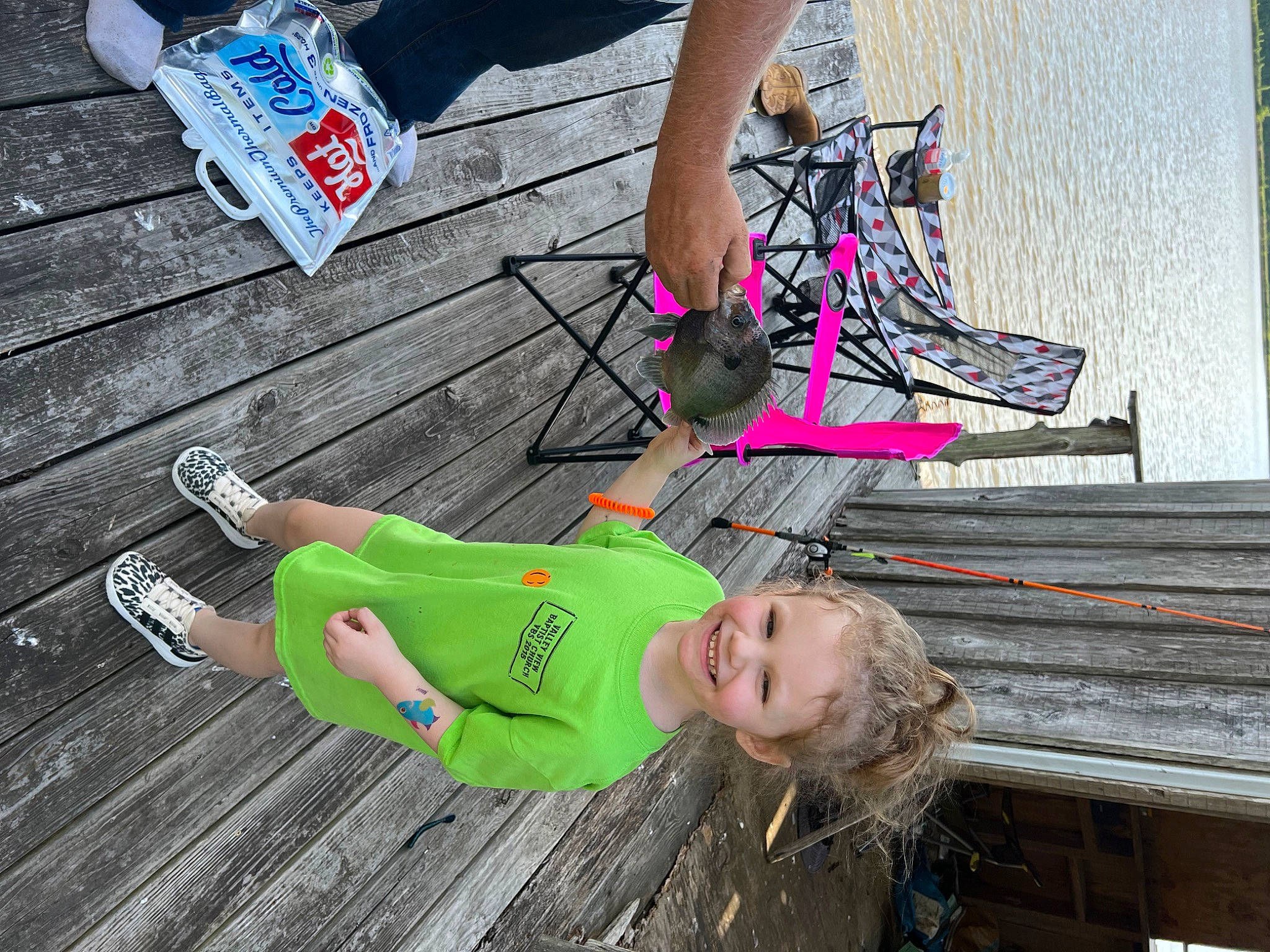 Kennedy is registered to the contest to win money with this photo: blue, calf, electric_blue, foot, footwear, grass, human_leg, joint, joy, leg, leisure, person, pink, recreation, sandal, shoe, sneakers, sportswear, street_fashion, thigh