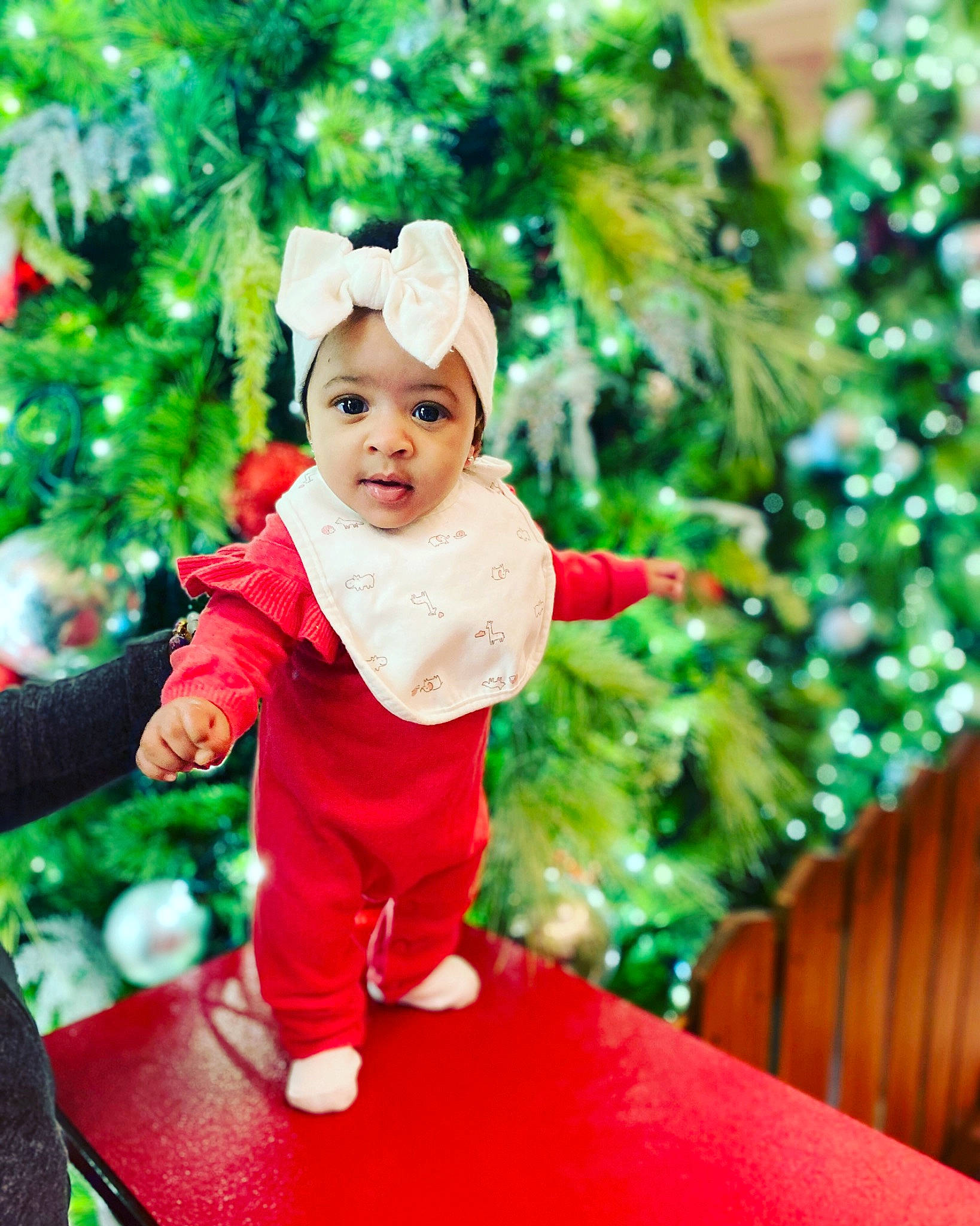Aubrei joined the competition — help win amazing prizes! baby, child, christmas, christmas_decoration, christmas_eve, christmas_ornament, christmas_tree, fictional_character, fir, happy, holiday, interior_design, person, play, red, smile, toddler, tree