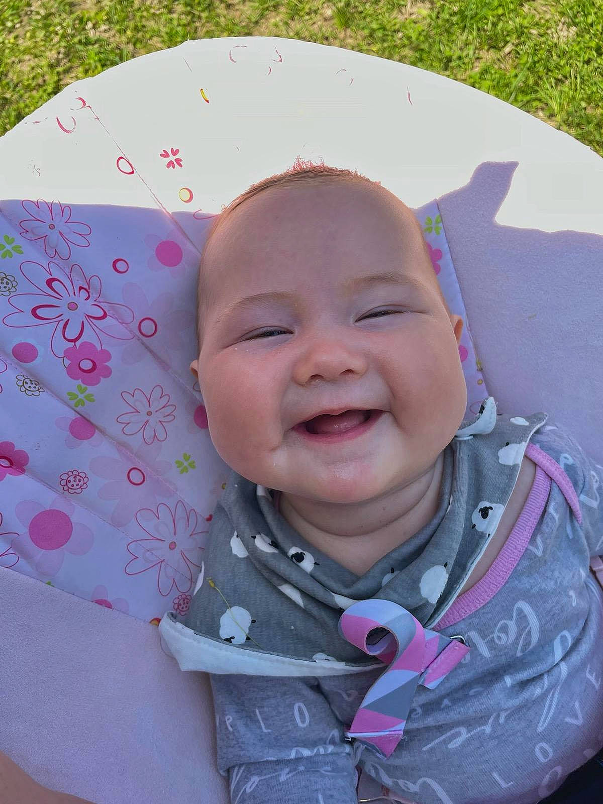 Delyla joined the competition — help win amazing prizes! baby, baby_laughing, baby_products, baby_toddler_clothing, cheek, child, chin, comfort, fun, grass, happy, head, iris, lip, magenta, person, pink, skin, sleeve, smile