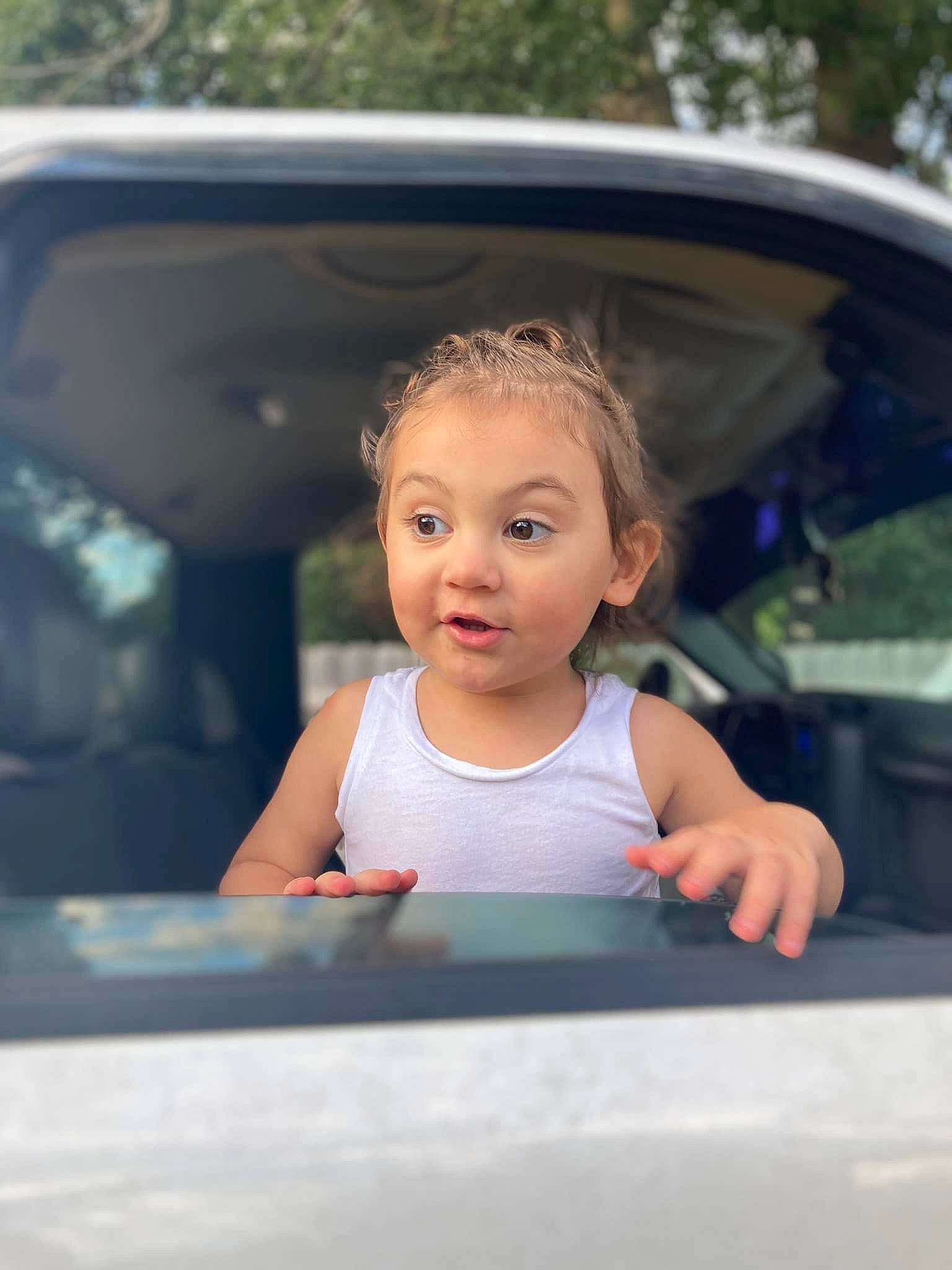 Brooklynn is registered to the contest to win money with this photo: auto_part, automotive_design, automotive_exterior, automotive_lighting, automotive_mirror, blond, bumper, child, dress, family_car, flash_photography, fun, glass, happy, leisure, motor_vehicle, person, surprise, tints_and_shades, toddler