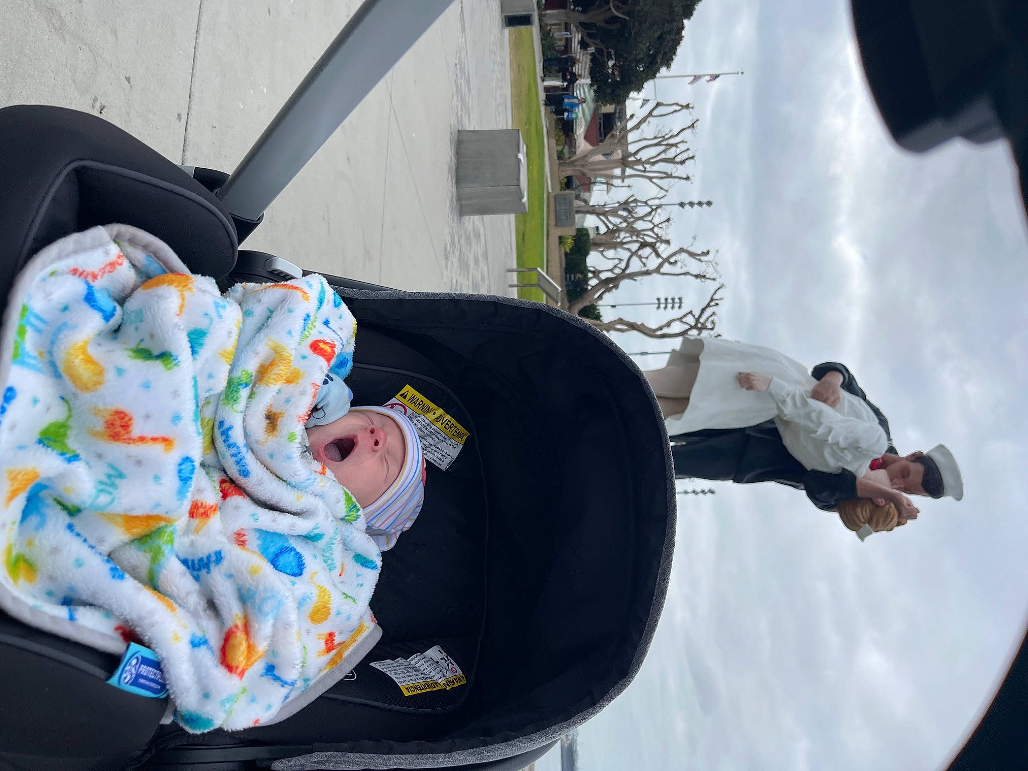 Alex is registered to the contest to win money with this photo: baby, baby_carriage, baby_products, baby_toddler_clothing, car_seat, child, cloud, comfort, fun, hat, leisure, person, recreation, sky, snow, toddler, travel, tree, winter