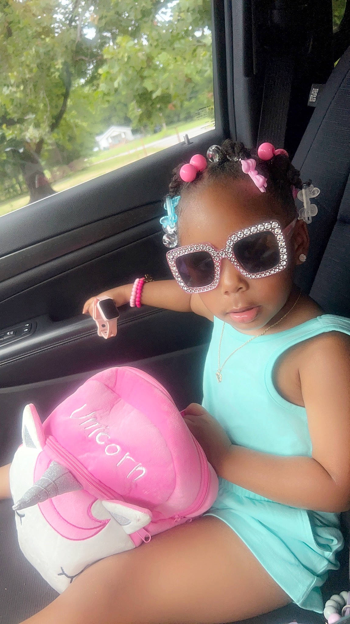 Rileigh is registered to the contest to win money with this photo: automotive_design, child, cool, eyewear, fun, glasses, goggles, head, headgear, leisure, magenta, person, personal_protective_equipment, pink, steering_wheel, summer, sunglasses, swimming_pool, thigh, vehicle_door