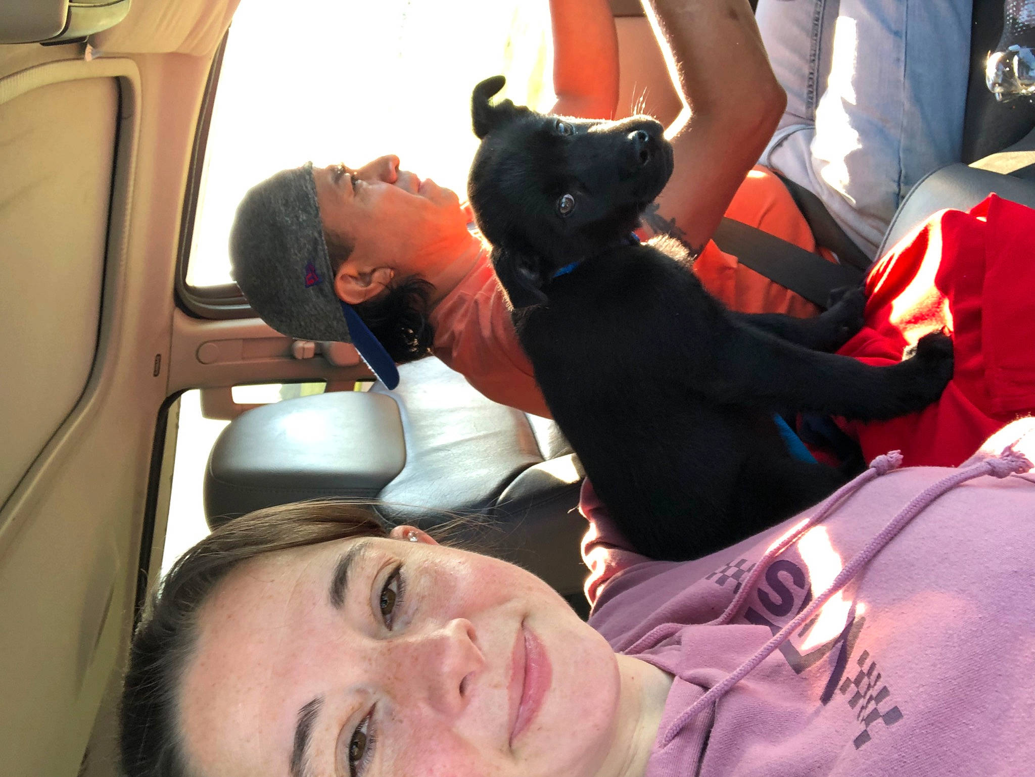 Champion is registered to the contest to win money with this photo: auto_part, automotive_exterior, black_hair, car_seat, comfort, event, family_car, fun, gesture, human, human_body, luxury_vehicle, mammal, motor_vehicle, mouth, passenger, people, smile, t_shirt, vehicle_door