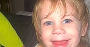 Kase joined the competition — help win amazing prizes! child, toddler, smile, pajamas, bed, hair, happy, indoor, face, blue_eyes, cute, sleepwear, person, portrait, light_skin, funny_hair, cozy, home, young_child, comfort