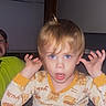 Kase joined the competition — help win amazing prizes! toddler, child, pajamas, indoor, bedtime, hands_up, blue_eyes, blond_hair, messy_hair, expression, person, sitting, window, curtains, bed, sibling, funny_face, cute, nighttime, young_child