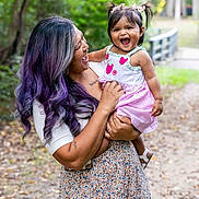 Raya joined the competition — help win amazing prizes! woman, child, toddler, smiling, outdoor, nature, forest, path, dress, hair, purple_hair, happy, holding, playful, person, family, daylight, cute, greenery, emotion