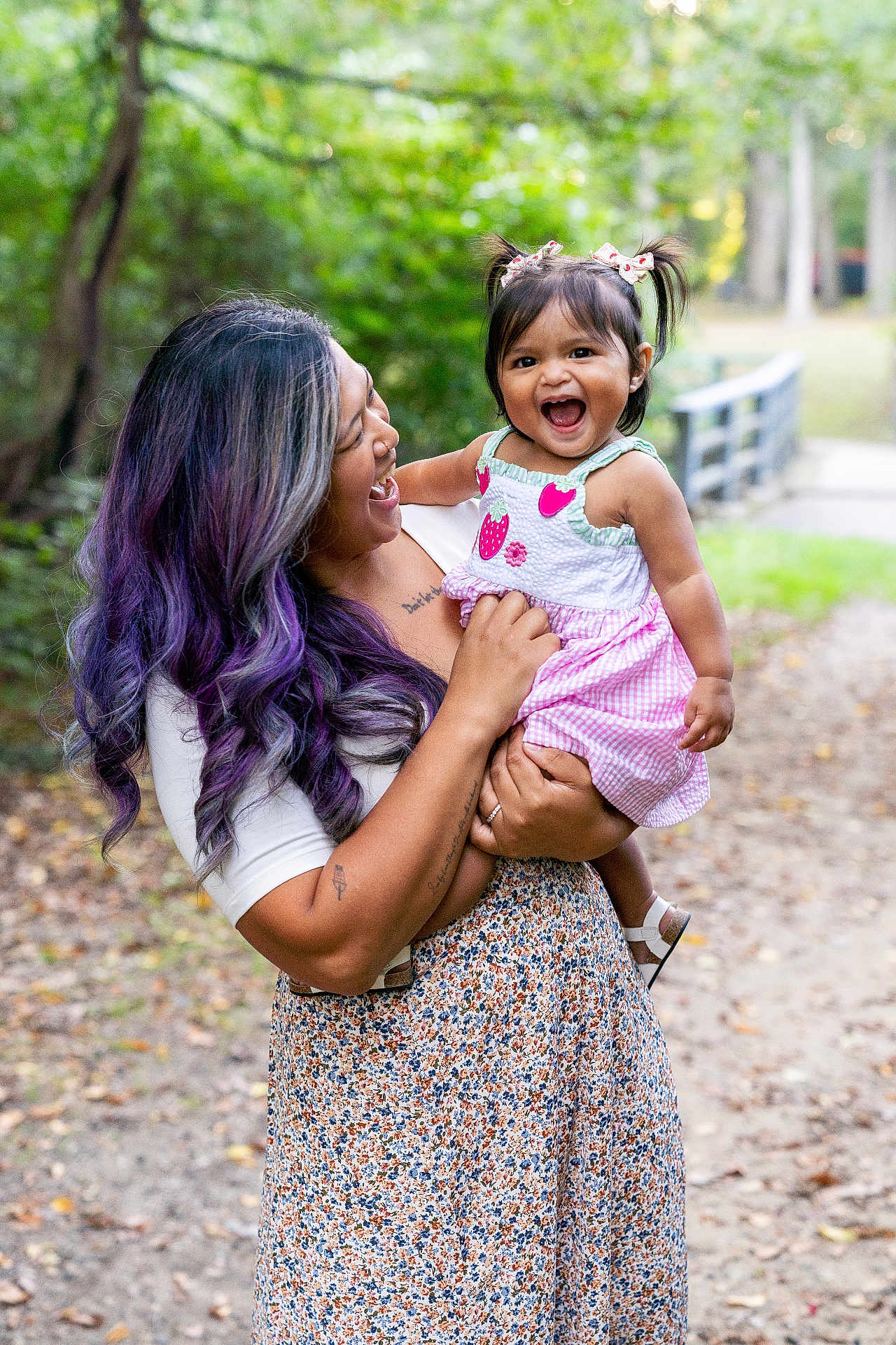 Raya joined the competition — help win amazing prizes! woman, child, toddler, smiling, outdoor, nature, forest, path, dress, hair, purple_hair, happy, holding, playful, person, family, daylight, cute, greenery, emotion