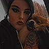 person, dog, tattoo, hand, face, makeup, window, indoor, pet, fur, portrait, hug, black_clothing, calm, closeup, animal, cozy, casual, expression, home