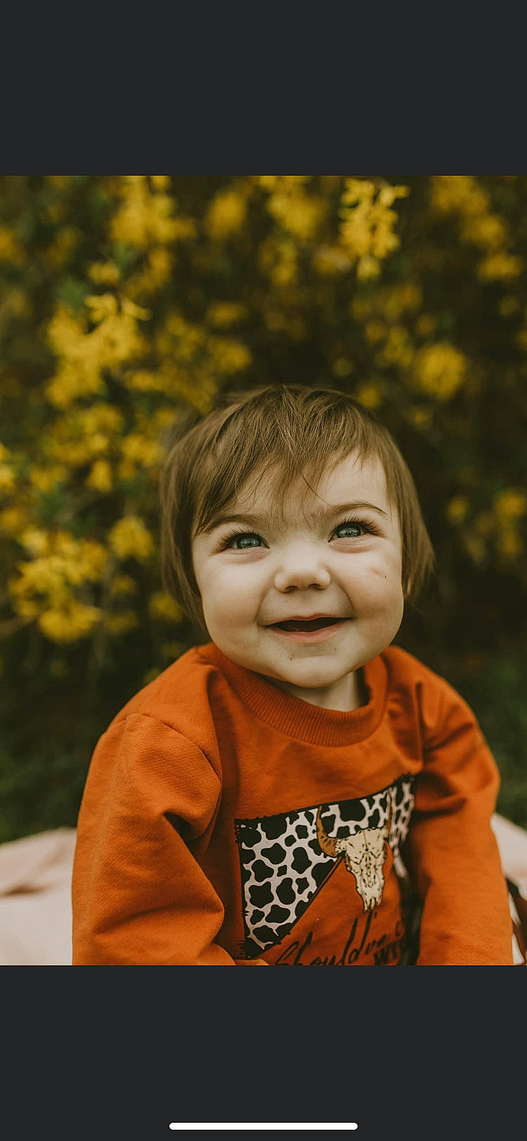 Shae joined the competition — help win amazing prizes! baby_toddler_clothing, cheek, chin, dress, eye, face, grass, hair, happy, head, iris, joy, leaf, orange, people_in_nature, person, plant, skin, sleeve, smile