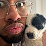 accessories, adult, animal, beard, bodypart, canine, dog, face, finger, glasses, hand, head, hound, male, man, person, pet, photography, portrait, puppy