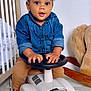 Hélio participe au concours pour gagner de l'argent avec cette photo : toddler, child, denim_shirt, toy_car, vintage_car, indoor, nursery, crib, rocking_horse, plush_toy, carpet, curly_hair, white_shoes, hands, steering_wheel, expression, cute, playtime, furniture, baby