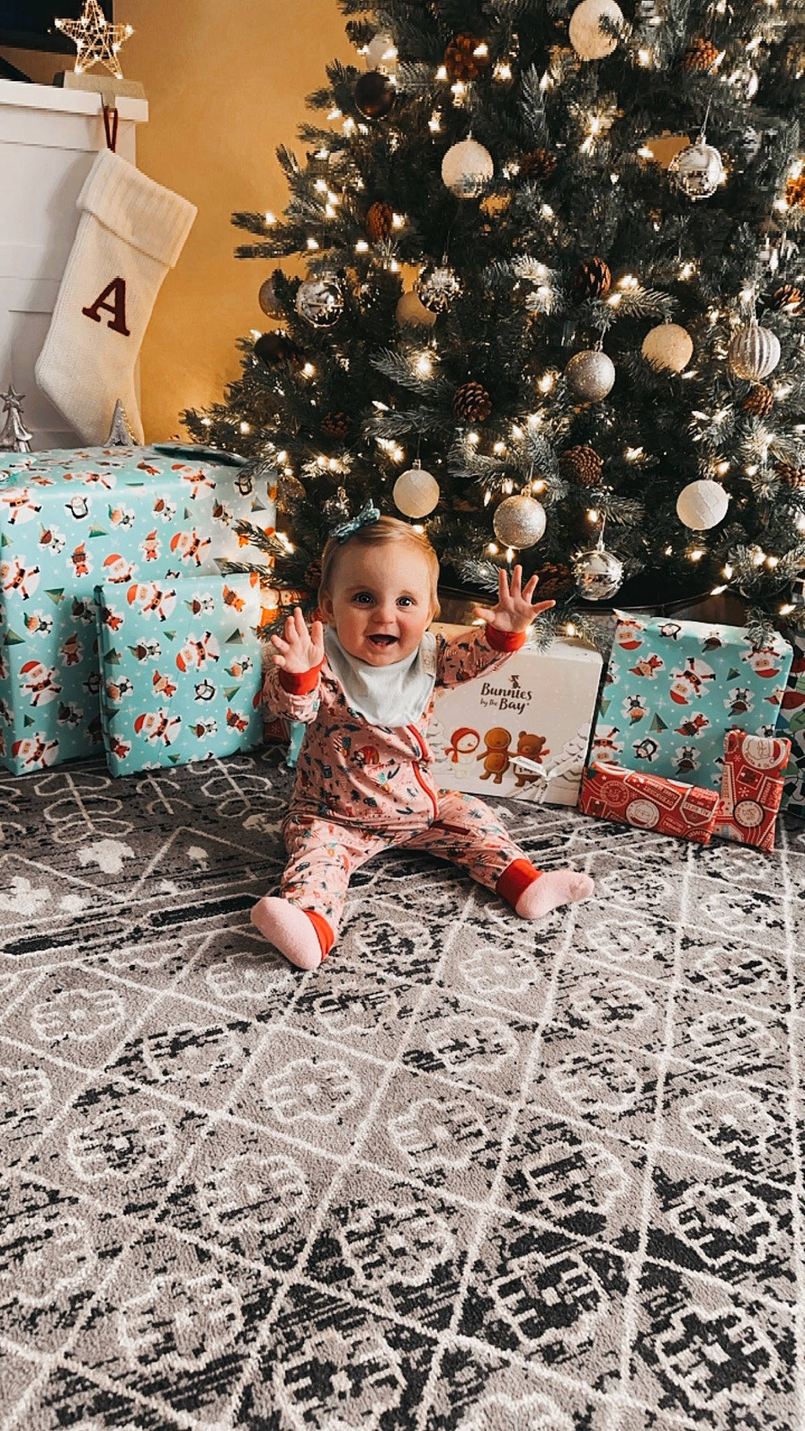 Allie is registered to the contest to win money with this photo: child, christmas, christmas_decoration, christmas_ornament, christmas_tree, flooring, fun, happy, holiday, holiday_ornament, human_body, leaf, living_room, mammal, ornament, people, person, smile, toddler, tree