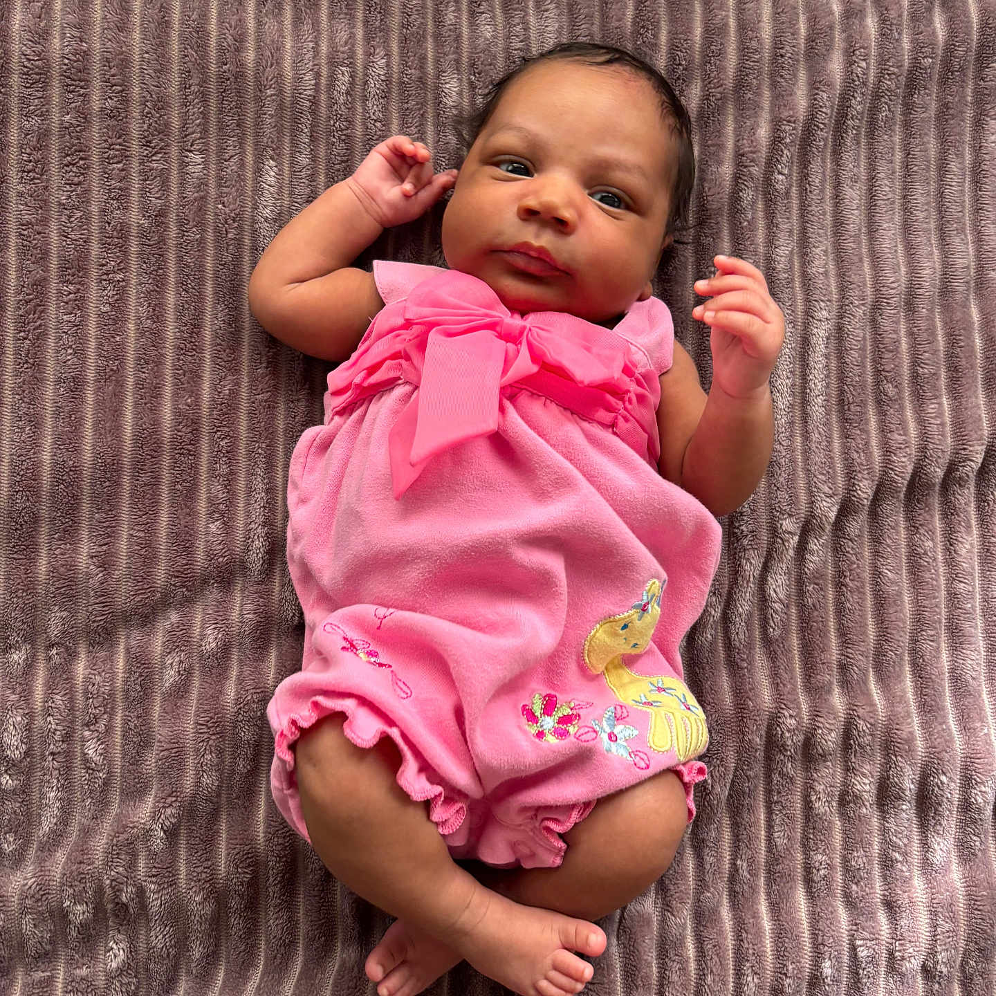 Avria is registered to the contest to win money with this photo: applique, baby, blanket, bodypart, clothing, dress, face, finger, furniture, hand, happy, head, newborn, pants, person, photography, portrait, shorts, sitting, smile