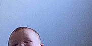 Roselyn is registered to the contest to win money with this photo: baby, background, candid, cheek, child, curly_hair, expression, face, head, indoor, infant, light, peeking, person, portrait, shadow, skin, smiling, wall, young
