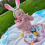 Roselyn joined the competition — help win amazing prizes! baby, blanket, bunny_ears, child, colorful, cute, easter, easter_eggs, grass, headwear, holiday, infant, nature, outdoor, pink_clothing, playful, sitting, smiling, spring, toy