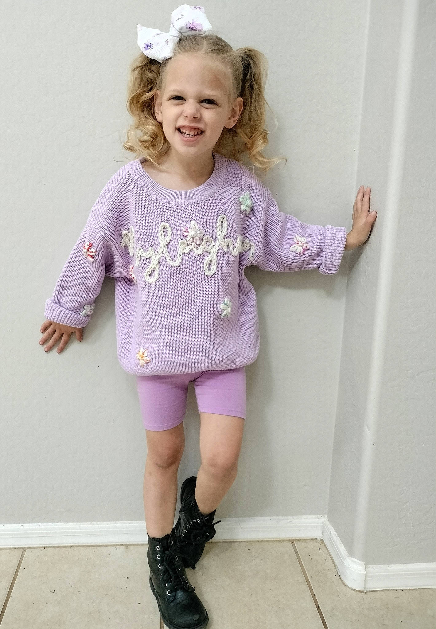 Ryleighann joined the competition — help win amazing prizes! baby_toddler_clothing, eye, face, gesture, hair, happy, head, joint, joy, knee, magenta, neck, pattern, person, pink, purple, shoe, sleeve, smile, toddler