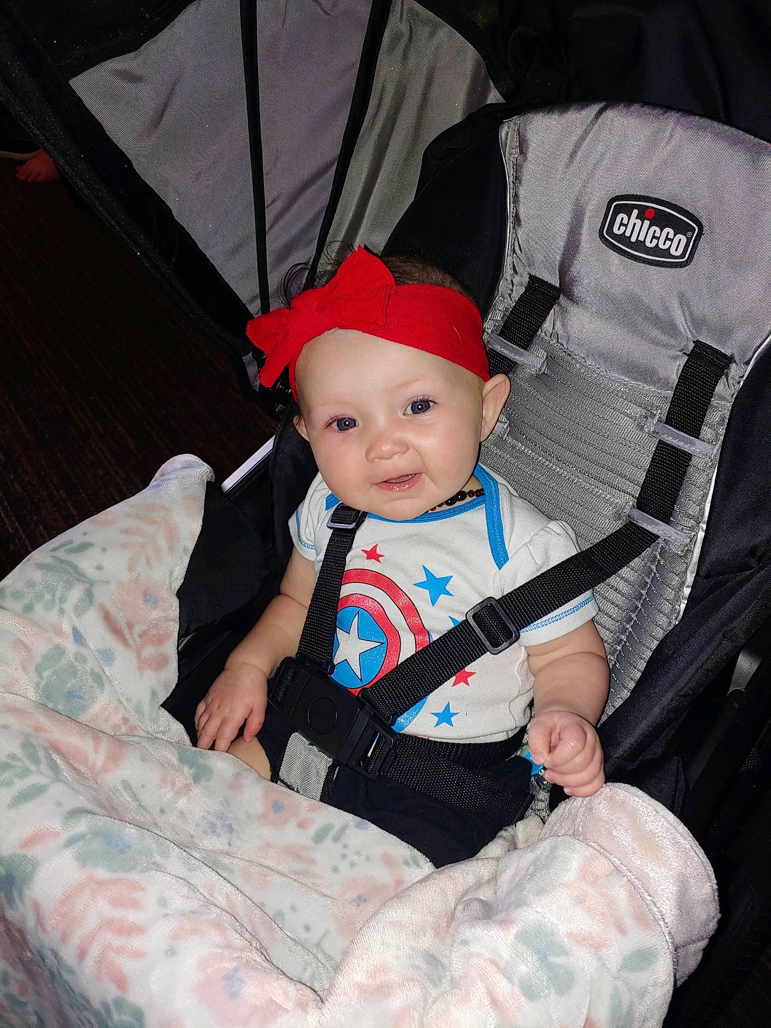 Zeppelin is registered to the contest to win money with this photo: baby, baby_carriage, baby_products, baby_toddler_clothing, cap, carmine, child, comfort, costume, costume_hat, electric_blue, eye, fashion_accessory, fun, hat, headwear, lap, pattern, person, sitting
