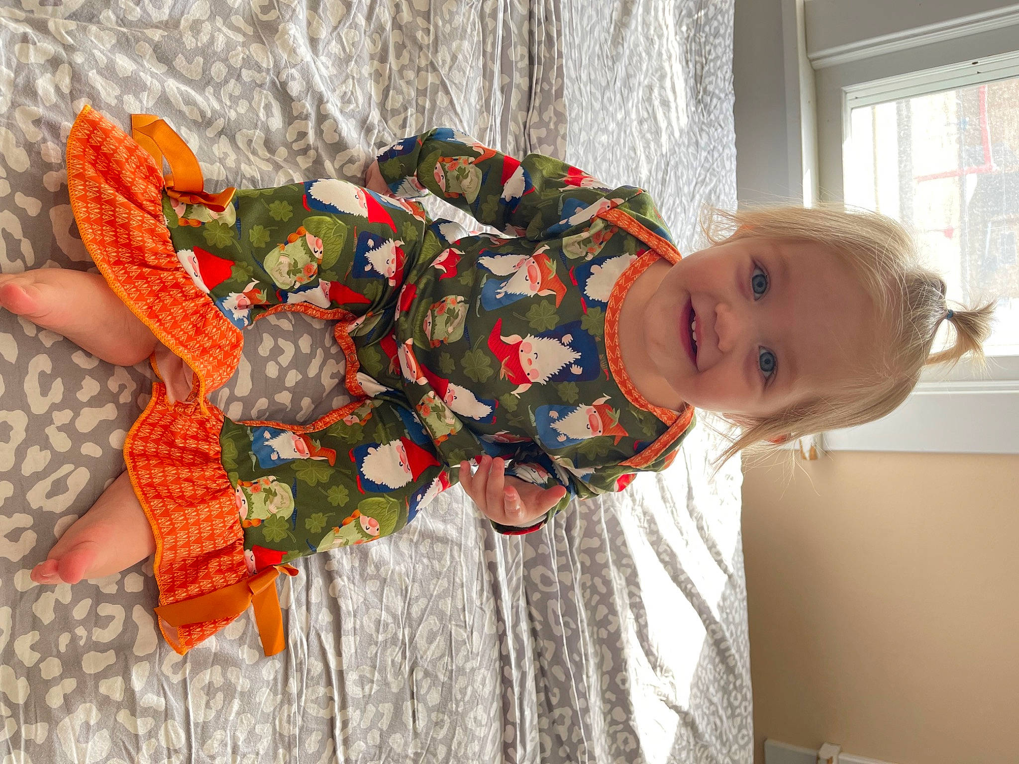 Emery is registered to the contest to win money with this photo: baby, baby_toddler_clothing, child, coquelicot, costume, happy, joy, linens, pattern, peach, person, room, smile, toddler, window, window_blind, wood
