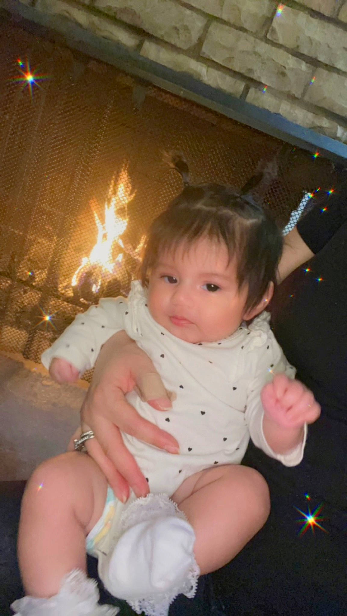 Aurelia is registered to the contest to win money with this photo: arm, baby, baby_toddler_clothing, cheek, child, event, finger, foot, fun, hairstyle, happy, human_leg, lap, leg, person, sitting, skin, thigh, thumb, toddler